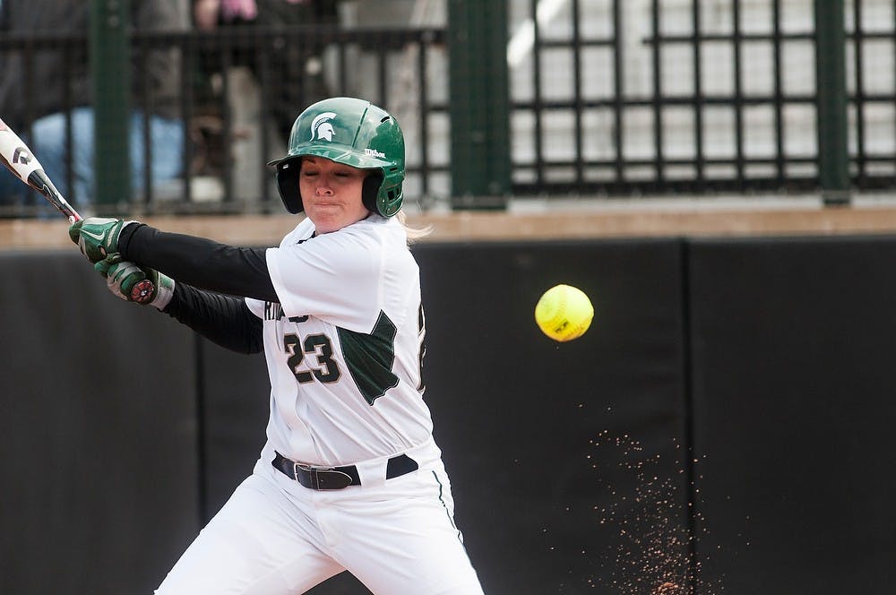 	<p>Sophomore short stop and outfielder Alyssa McBride hits a ball into foul territory  during the game against Michigan, April 14, 2013, at Secchia Stadium at Old College Field. Katie Stiefel/The State News</p>