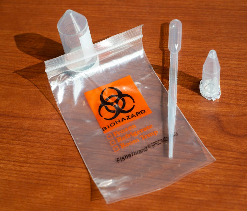 <p>After a spike in cases among students in East Lansing, MSU President Samuel L. Stanley Jr. urged the students, faculty and staff to sign up for the COVID-19 early detection program called Spartan Spit. Elements of the Spartan Spit Kit photographed above on Sept. 14, 2020.</p>