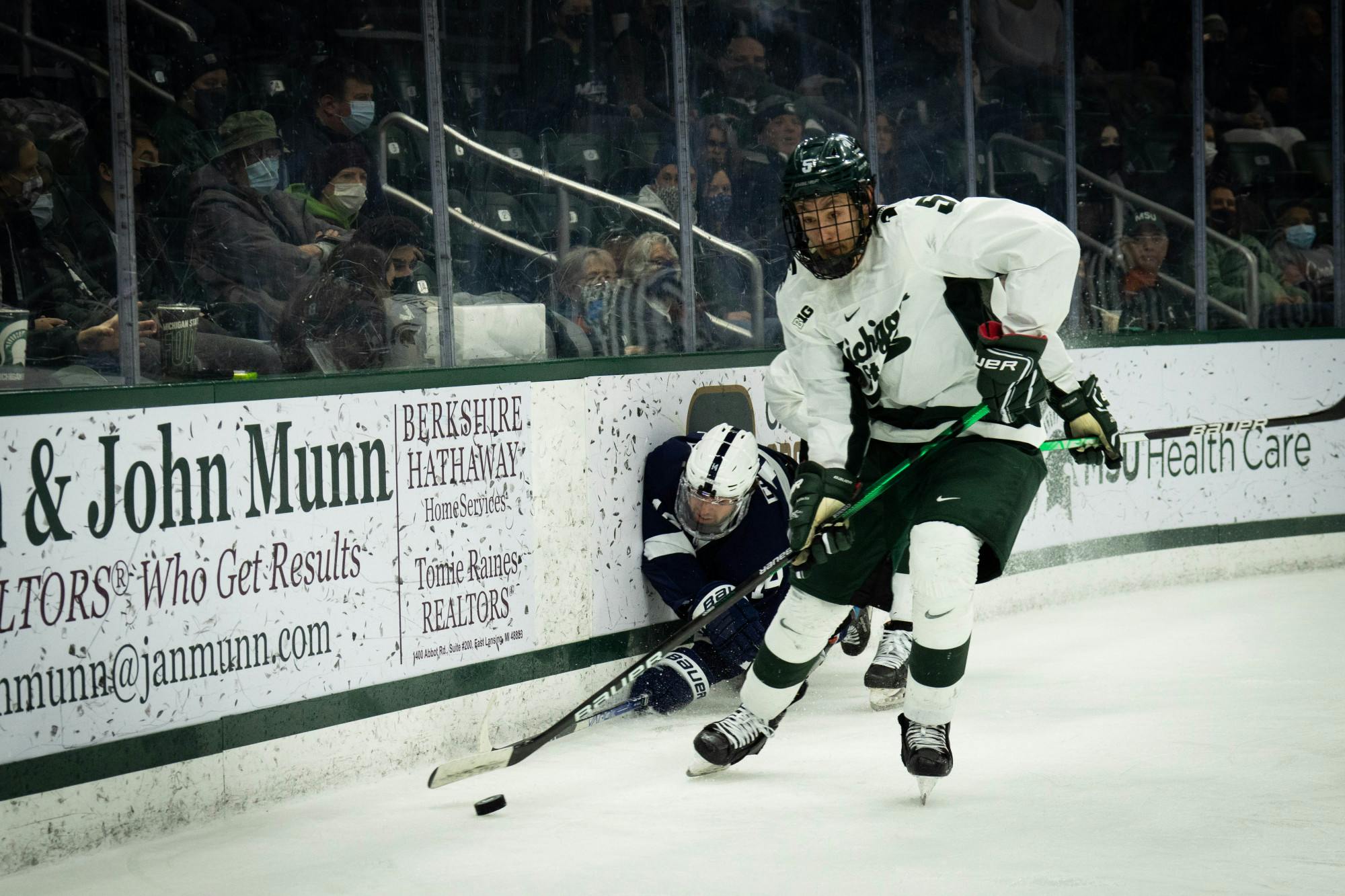 <p>Sophomore defenseman Powell Connor (5) leaves Penn State sophomore forward Christian Sarlo (10) in the dust during a game at Munn Ice Arena on Feb. 25, 2022. </p>