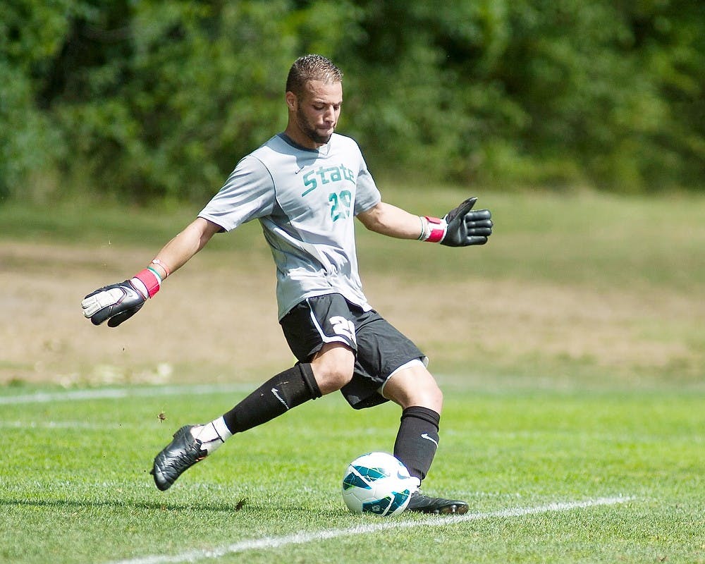 	<p>Red shirt senior and goal keeper Bryce Dobbins takes a goal kick on Monday, Sept. 3, 2012, at DeMartin Stadium. The Spartans lost to Connecticut with the final score beng 1-0. State News File Photo</p>