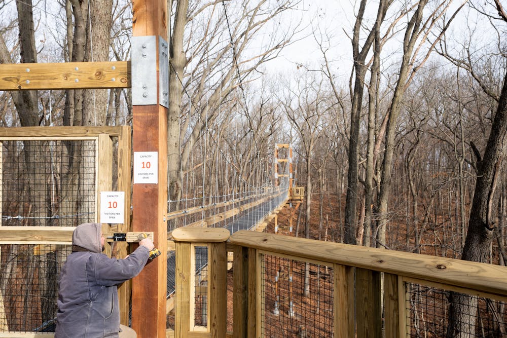 <p>The final screws drilled into the new canopy walk at Hidden Lake Gardens, on Dec. 2, 2022. Construction began on May 1, 2022 and ended on Dec. 9, 2022.</p>