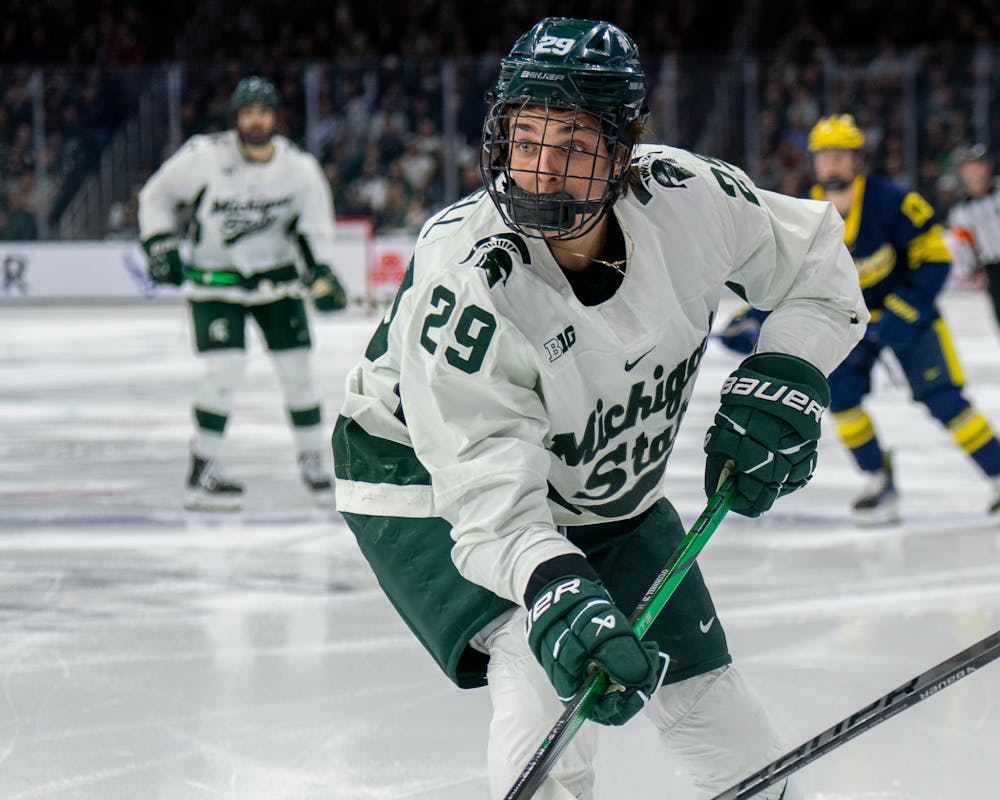<p>Freshman forward Gavin O'Connell (29) chasing after the puck during a game against University of Michigan at Munn Ice Arena on March 23, 2024.</p>