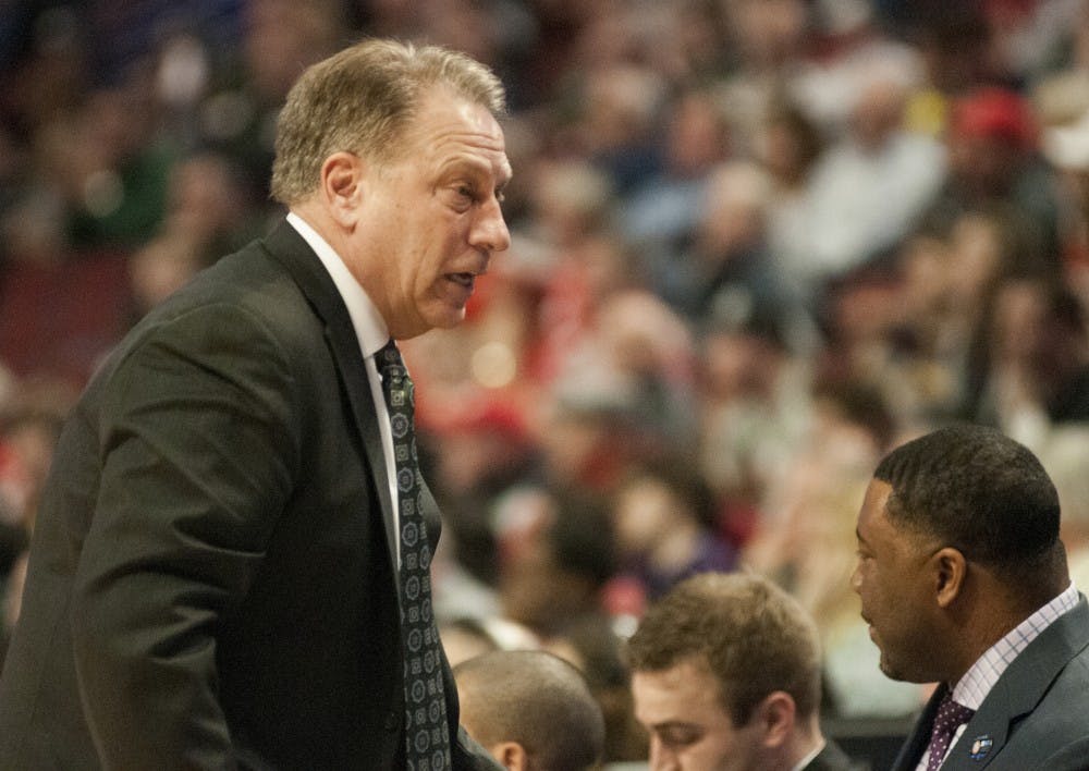 <p>Coach Tom Izzo talks to the players on the bench Mar. 13, 2015, during the game against Ohio State at the Big Ten Tournament at United Center in Chicago. The Spartans defeated the Buckeyes, 76-67. Kelsey Feldpausch/ The State News</p>