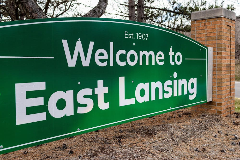 'Welcome to East Lansing Est. 1907' reads on a sign near the intersection of N Hagadorn Rd and E Saginaw Hwy in East Lansing, Michigan on Monday, March 23, 2026. 