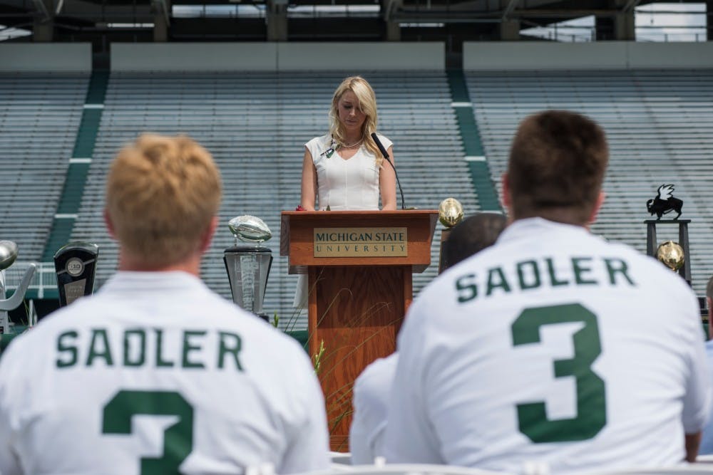 Katie Sadler, sister of Mike Sadler, gives a speech during the celebration of life for her brother and former Michigan State punter Michael R. Sadler on July 31, 2016 at Spartan Stadium. Sadler and Nebraska punter Samuel N. Foltz were killed in a car accident on their way home from a kicking camp in Merton, Wisc.