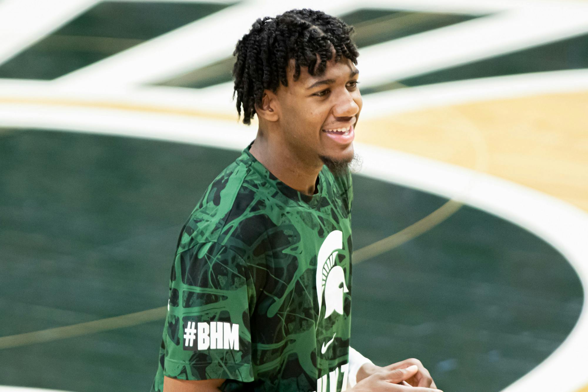 Junior forward Aaron Henry smiles before the Wolverines matchup with the Spartans on Mar. 6, 2021.