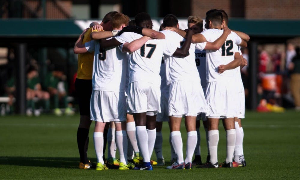 <p>The men's soccer team huddles at half-time during a game against Dartmouth on Sep. 1, 2017 at DeMartin Stadium at Old College Field. The Spartans defeated the Big Greens 1-0.</p>