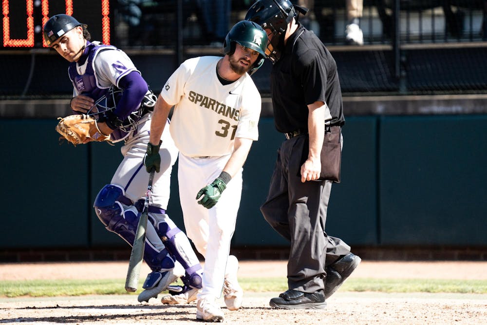 <p>Michigan State graduate catcher Caleb Berry (31) misses the ball at Jeff Ishbia Field on April 12, 2025</p>