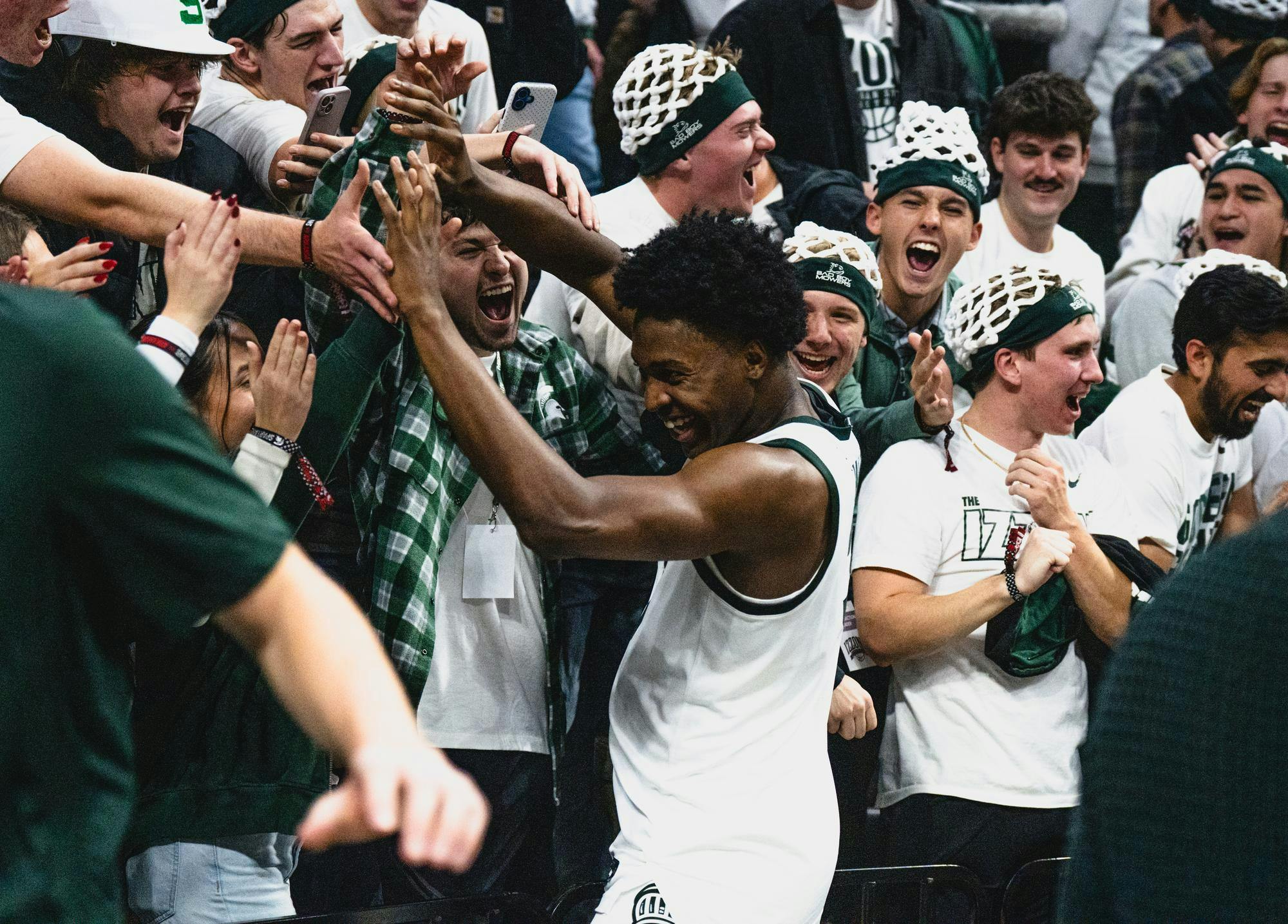 MSU freshman forward Cam Ward (3) hi-fives fans at the Breslin Center in East Lansing, MI, on Nov. 8, 2025.
