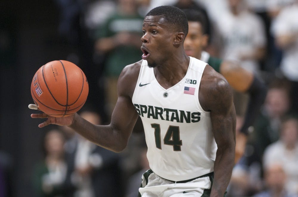 Junior guard Eron Harris looks to pass during the second half of the basketball game against Eastern Michigan on Nov. 23, 2015 at the Breslin Center. The Spartans defeated the Eagles, 89-65. 