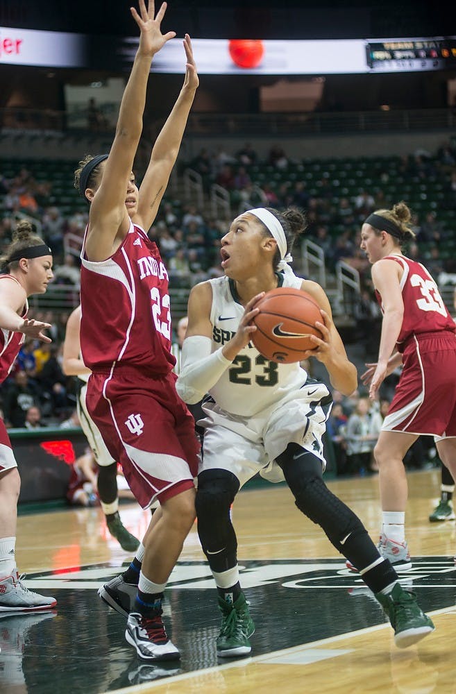 <p>Sophomore forward Aerial Powers is blocked by Indiana guard Alexis Gassion on Jan. 28, 2015, during the game at Breslin Center. The Spartans were leading the Hoosiers at halftime, 39-25. Emily Nagle/The State News</p>