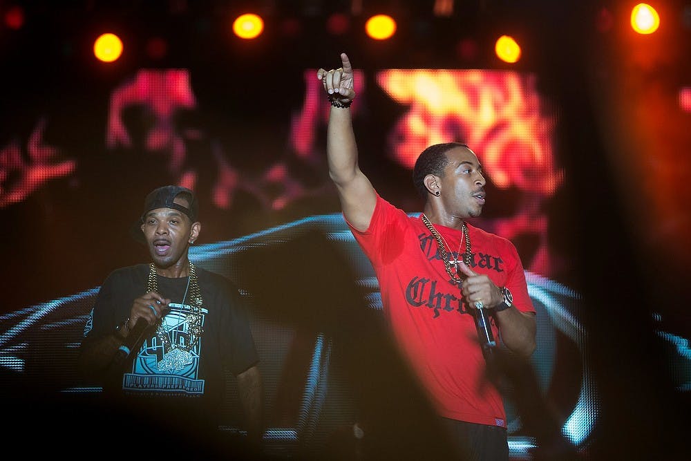 	<p>Rapper Ludacris, right, performs on stage with Lil&#8217; Fate, July 14, 2013, at Adado Riverfront Park in Lansing during Common Ground Music Festival. This was the last day of the seven-day music event. Justin Wan/The State News</p>