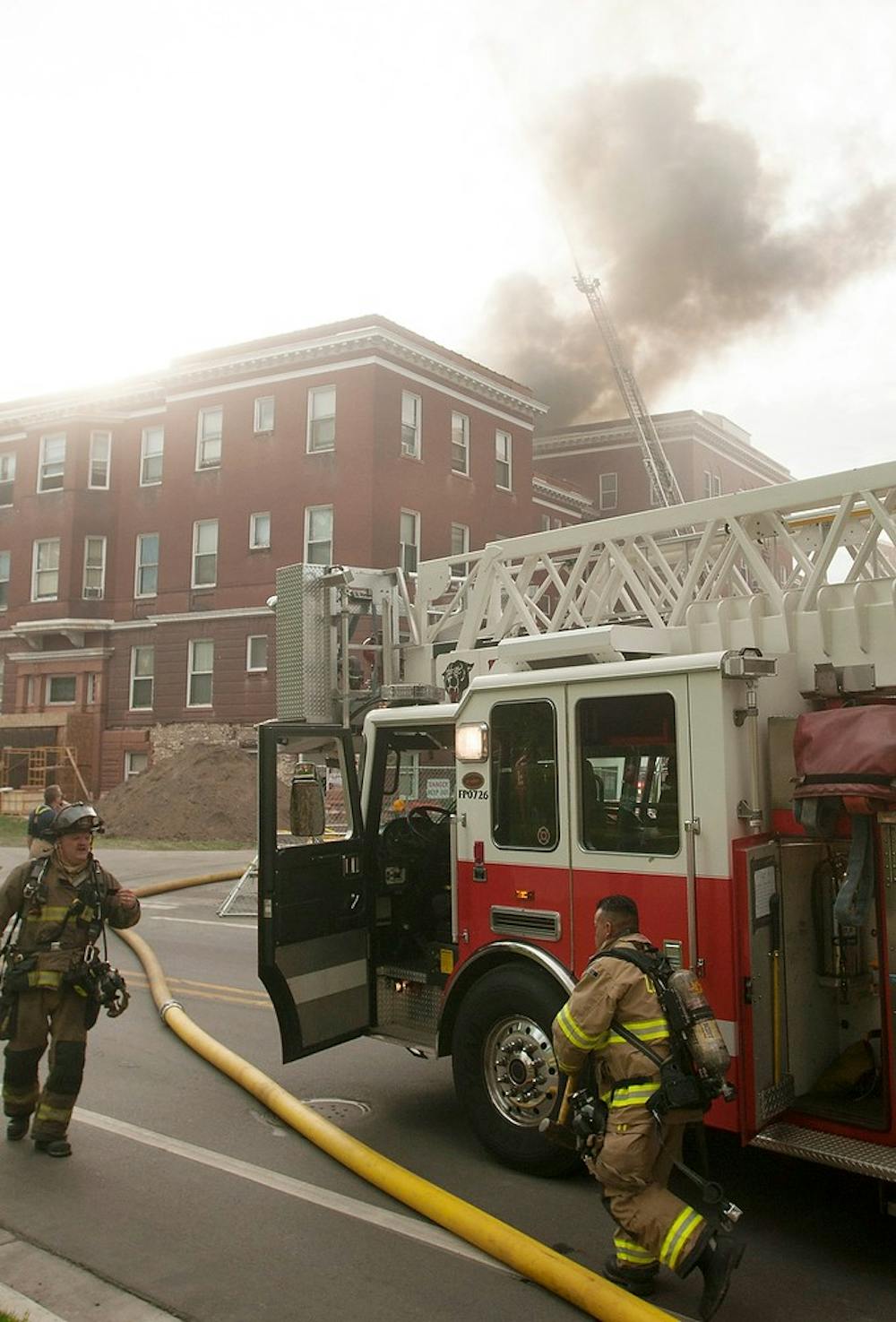 	<p>Fire fighters respond to a fire May 15, 2013, at Morrill Hall. The cause of the fire is still unknown. Weston Brooks/The State News</p>