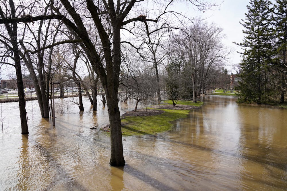 Campus sidewalks flood after a heavy rainfall on April 5, 2023. 