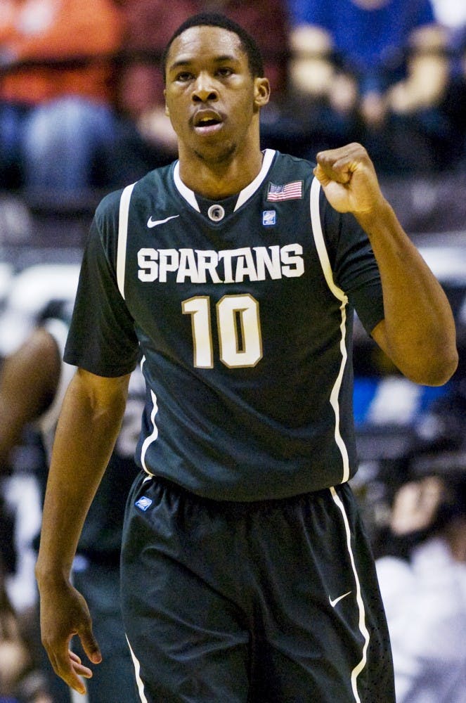 Junior forward Delvon Roe celebrates after a play Friday at Conseco Fieldhouse in Indianapolis. Roe had 8 rebounds in the Spartans' 74-56 victory over the Purdue Boilermakers. Matt Radick/The State News