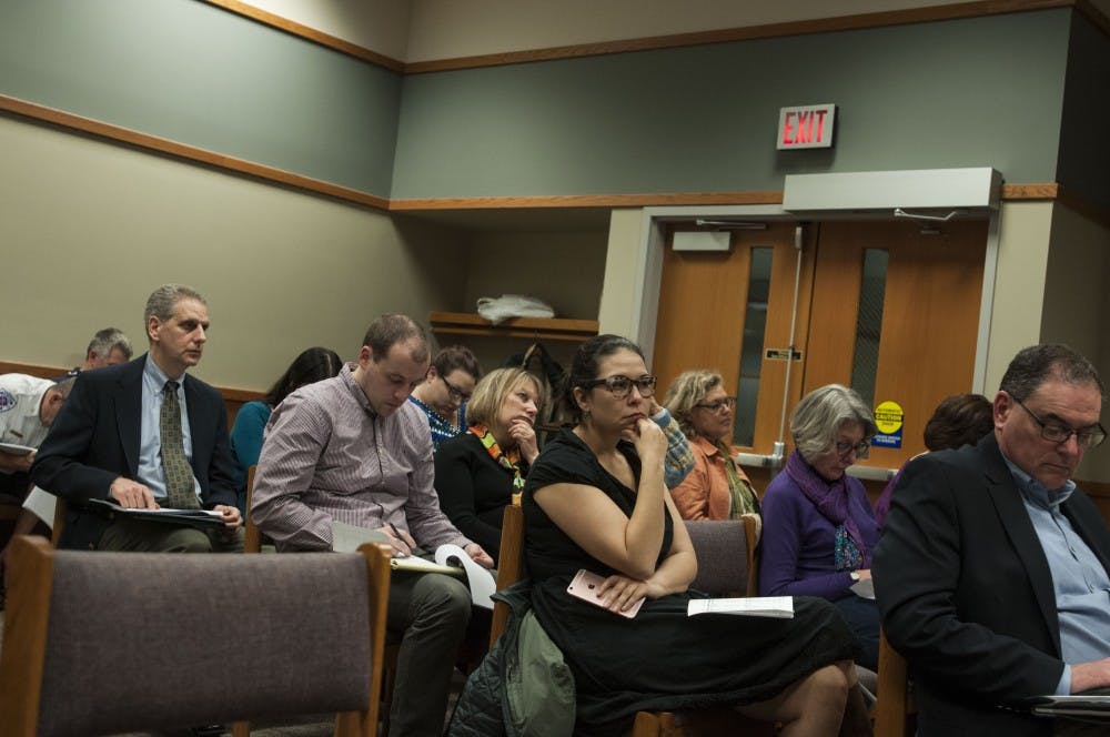 Audience members listen during the City of East Lansing budget meeting on Feb. 20, 2018 at 54B District Court. (C.J. Weiss | The State News)