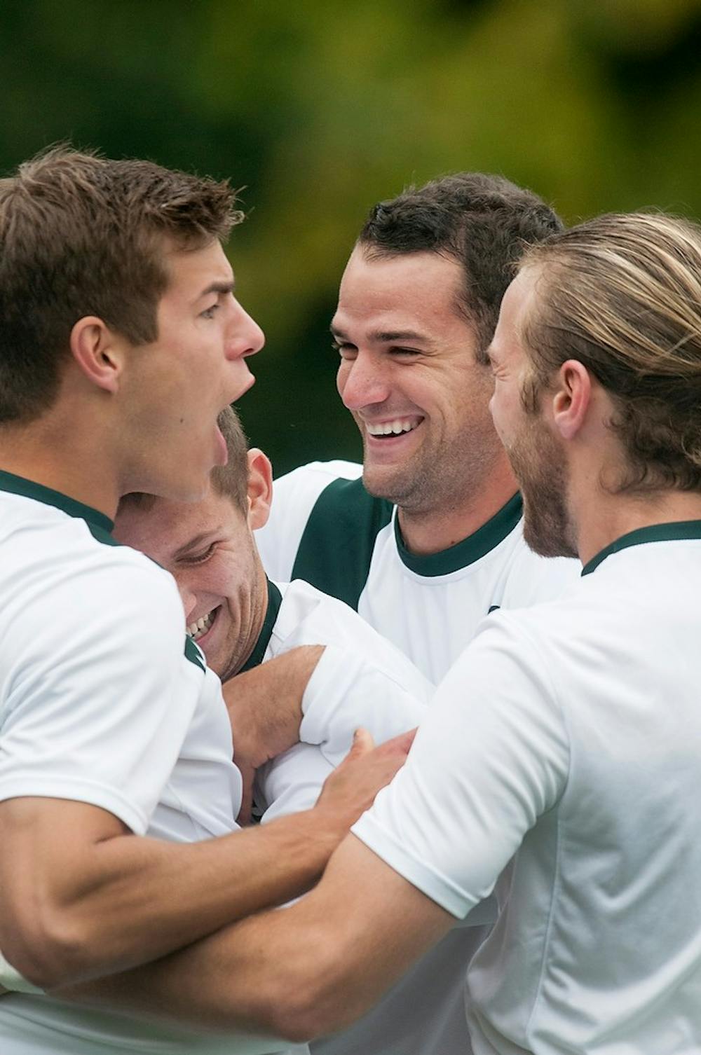 	<p>From left, senior defender Kevin Cope, junior forwards Tim Kreutz and Adam Montague, and junior defender Ryan Keener celebrate after a goal is scored by sophomore midfielder Jay Chapman during the game against Oakland, Oct. 16, 2013, at DeMartin Soccer Stadium at Old College Field. <span class="caps">MSU</span> defeated Oakland 3-0. Danyelle Morrow/The State News</p>