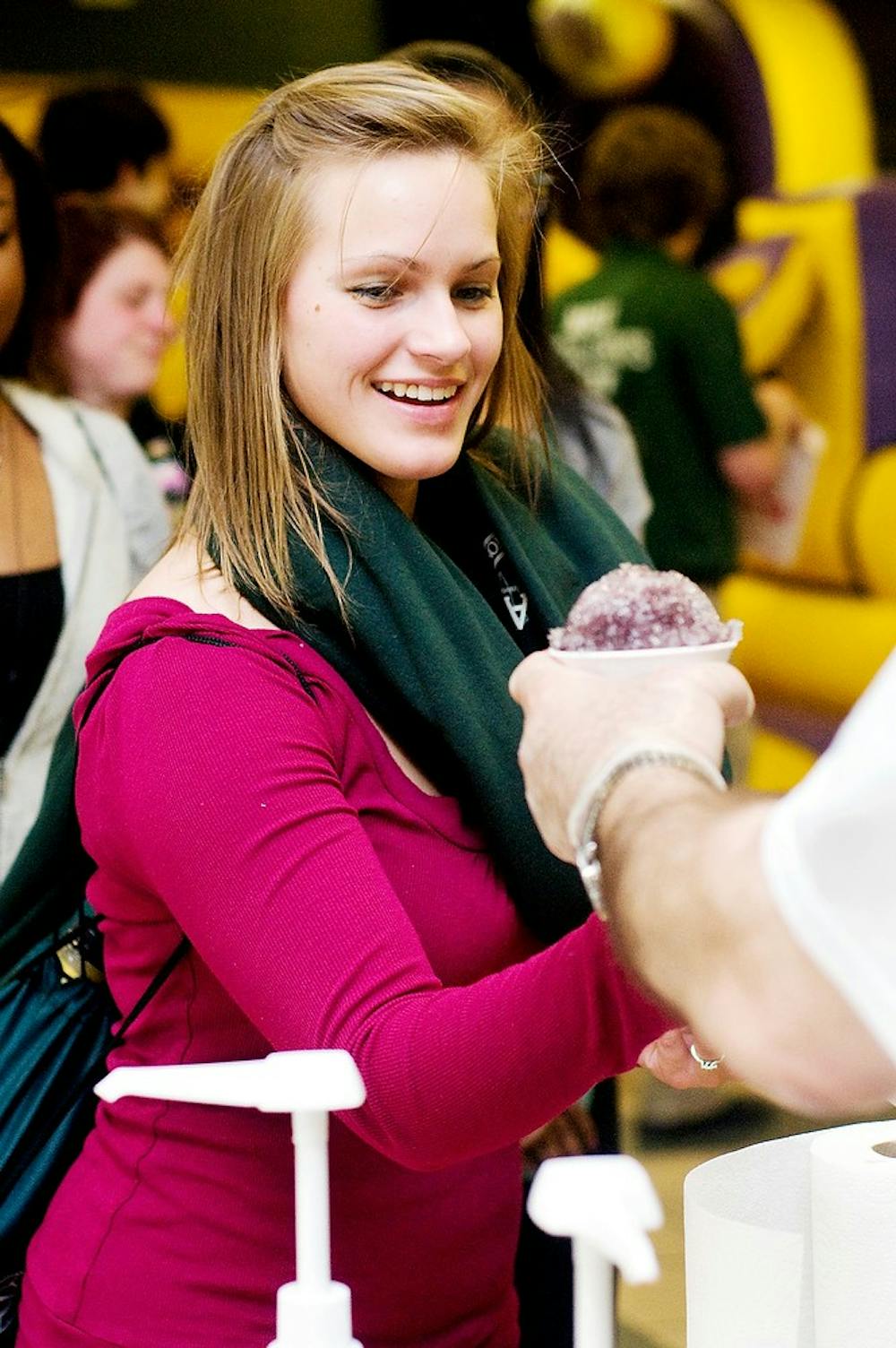 	<p>Medical technician junior Amber Suttorp gets a snow cone in April 2012 at Sparty&#8217;s Spring Party held at the International Center, 427 North Shaw Lane. <span class="caps">ASMSU</span>, <span class="caps">MSU</span>&#8217;s undergraduate student government, will vote on whether to allocate $2,000 to help fund the 2013 party. </p>