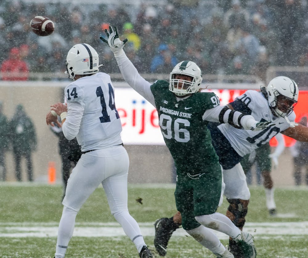 <p>Michigan State&#x27;s redshirt senior defensive end Jacub Panasiuk (96) attempts to block a throw by Penn State&#x27;s redshirt senior quarterback Sean Clifford (14) on Nov. 27, 2021.</p>