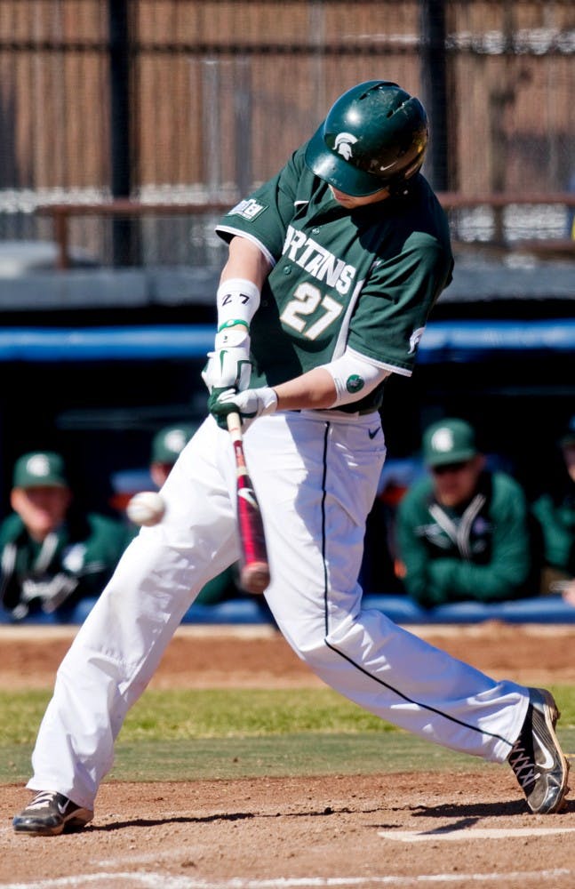 	<p>Senior first baseman Jeff Holm hits the ball March 27 at Ray Fisher Stadium at Wilpon Baseball Complex in Ann Arbor. The Spartans defeated Michigan, 5-4.</p>