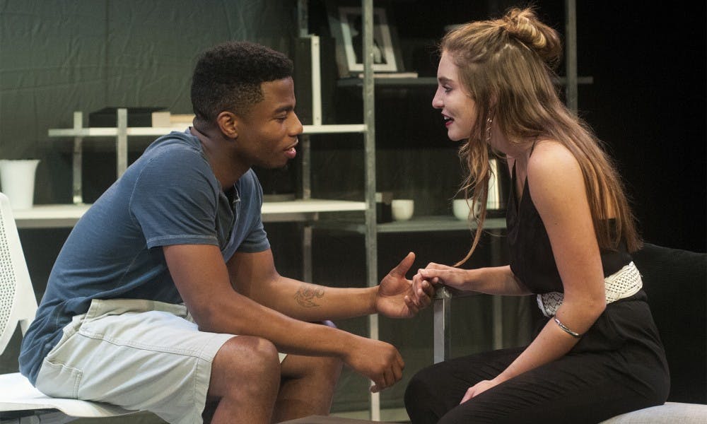 <p>Bryant, played by theatre junior Gary Patterson, talks with his girlfriend Fiona, played by theatre junior Christi Thibodeau during "Baltimore," a play put on by the MSU Theatre Department on Oct. 6, 2015 in the Auditorium. The 90 minute production tells the story of a group of college students who confront their own perceptions of race when a student draws a racist picture on another student's door. </p>