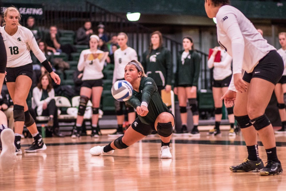 Freshman libero Jayme Cox (4) passes a ball during the game against Indiana on November 18, 2017, at Jenison Fieldhouse. The Spartans defeated the Hoosiers, 3-0.
