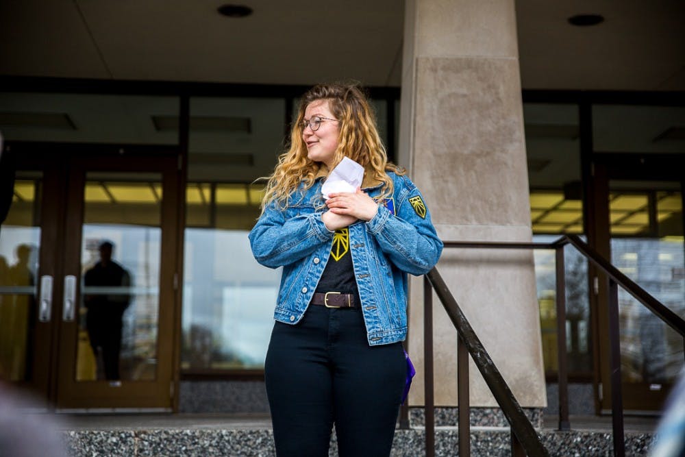 <p>Social relations and policy senior Shelby Krohn addresses the crowd during the Global Climate Strike Walkout on March 15, 2019 at the Hannah Administration Building.</p>