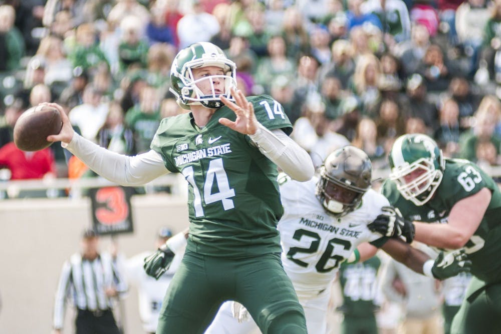 Sophomore quarterback Brian Lewerke (14) goes to throw the ball during the first half of the Green and White Spring Game on April 1, 2017 at Spartan Stadium. The White team led the first half against the Green team, 18-17.