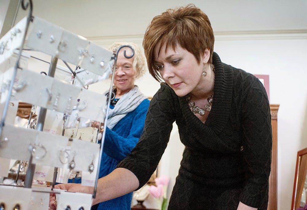 	<p>Mason resident Karen O&#8217;Connor, right,  looks at jewelry with East Lansing resident Linda Pivarnik on Wednesday, Feb. 13, 2013, at Silver and Beyond, 333 Albert Ave., Ste. 102. The owner of Silver and Beyond, Siham Baladi, said that around Valentine&#8217;s Day there are more visits from men and students to the store. Katie Stiefel/The State News</p>