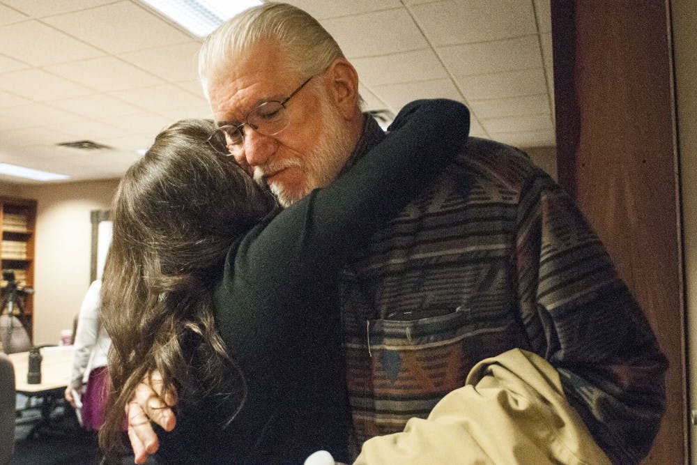 Lansing resident Larissa Boyce, left, hugs her father after a conversation about former MSU employee Larry Nassar on March 24, 2017 at Church Wyble P.C. at 2290 Science Parkway in Okemos. Boyce, a former MSU gymnast sexually abused by Nassar, has decided to dismiss anonymity in order to encourage change and challenge stigma. "When your house is robbed, you come forward. Well, our bodies were robbed," Boyce said. 
