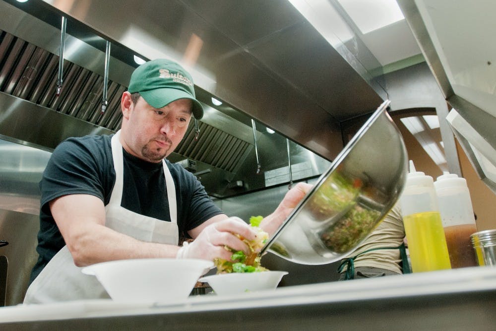 Prep cook Ray Rodriguez of Saginaw, Michigan plates a salad at Sultan's Thursday, May 17, 2012.  Sultan's is a new Middle Eastern cuisine restaurant located at 235 Ann Street. Adam Toolin/The State News