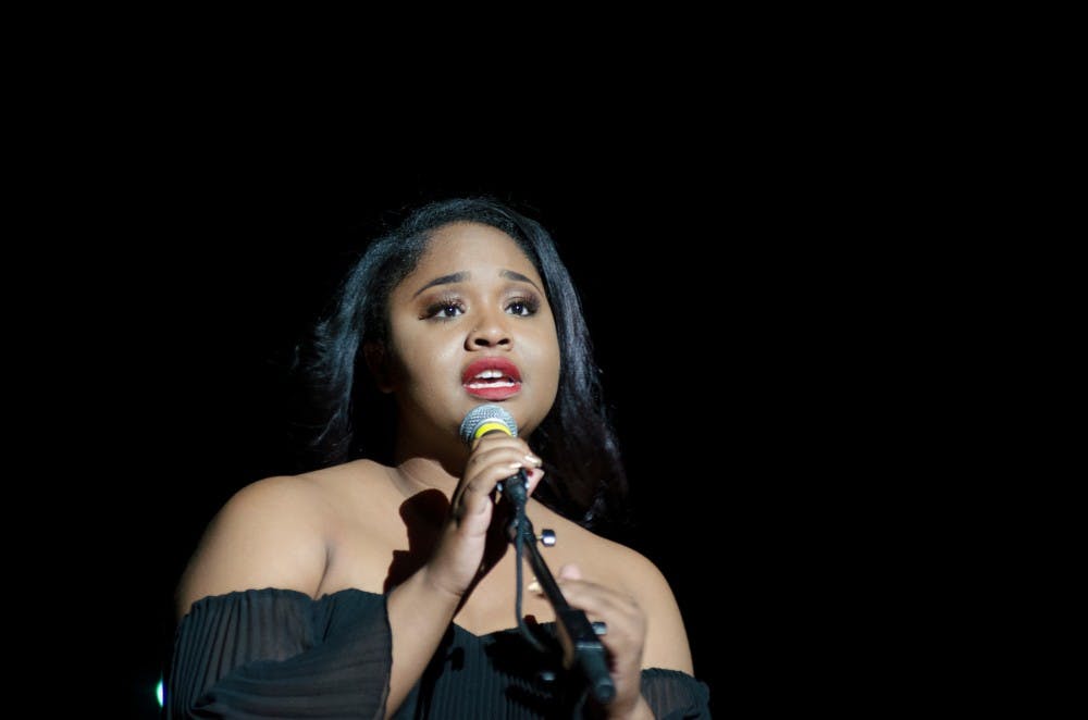 Kinesiology sophomore Hannah Brunson performs "Don't Touch My Hair" on stage at Wharton Center on Nov. 5, 2016. Brunson's performance was part of Liberty and Justice for [Insert Name Here] the 44th Annual MSU Black Student Alliance Black Power Rally.