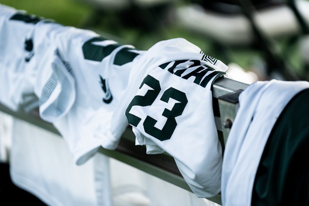 <p>Jerseys lay on the back of the bench before the anticipated matchup between the Spartans and the Notre Dame Fighting Irish on Aug. 29, 2022.</p>