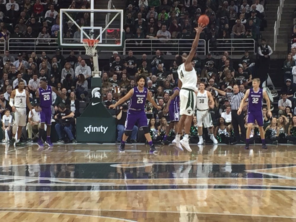 <p>Freshman forward Nick Ward receives&nbsp;a pass in a game against Northwestern University on Dec. 30, 2016 at the Jack Breslin Student Events Center.&nbsp;</p>