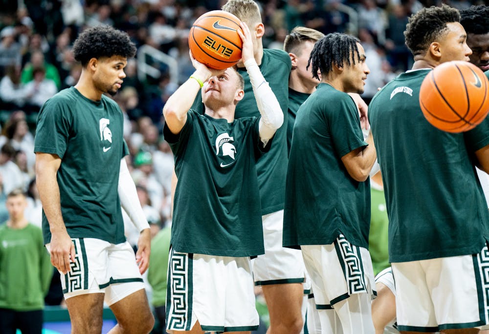 Senior guard Steven Izzo (13) shoots a basket during warmups before the second half during a game against Villanova at the Breslin Center on Nov. 18, 2022. The Spartans defeated the Wildcats 73-71. 