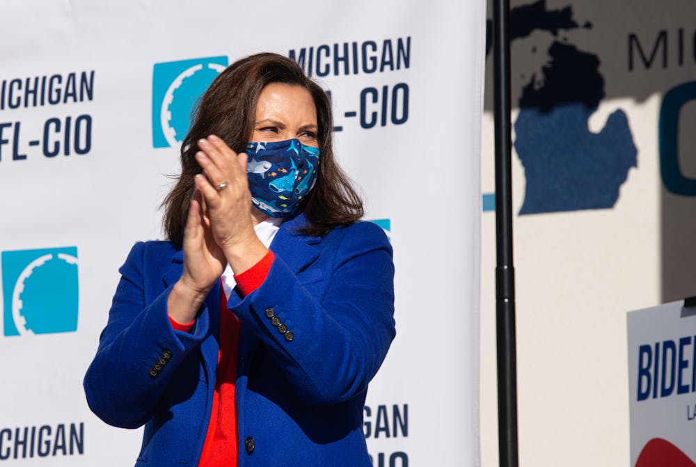 <p>Gov. Gretchen Whitmer applauds at a canvass launch event in Lansing, Michigan, on Nov. 3, 2020.</p>