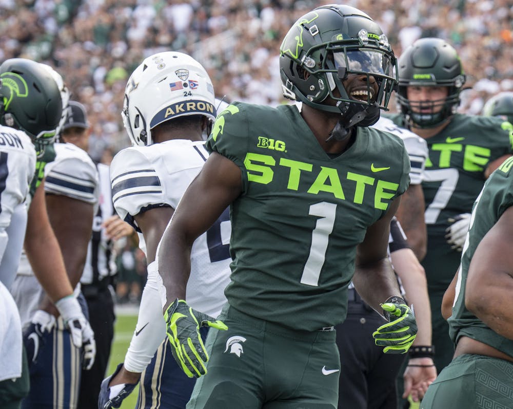 Redshirt senior Jayden Reed, 1, celebrates a touchdown during Michigan State’s game against Akron on Sat., Sept. 10, 2022 at Spartan Stadium. The Spartans earned a decisive victory with a final score of 52, zip. 
