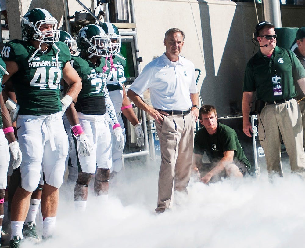 	<p>Head coach Mark Dantonio waits to run onto the field before the game against Indiana, Oct. 12, 2013, at Spartan Stadium. The Spartans defeated the Hoosiers, 42-28. Danyelle Morrow/The State News</p>