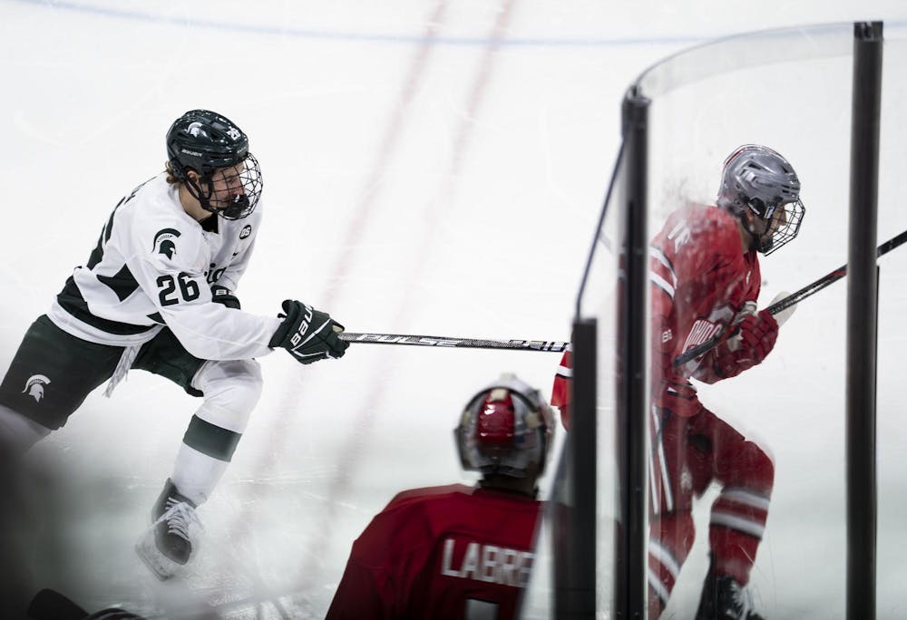 <p>MSU freshman forward Eric Nilson (26) chases after OSU junior forward Max Montes (16) in the Munn Ice Arena on March 14, 2026.</p>