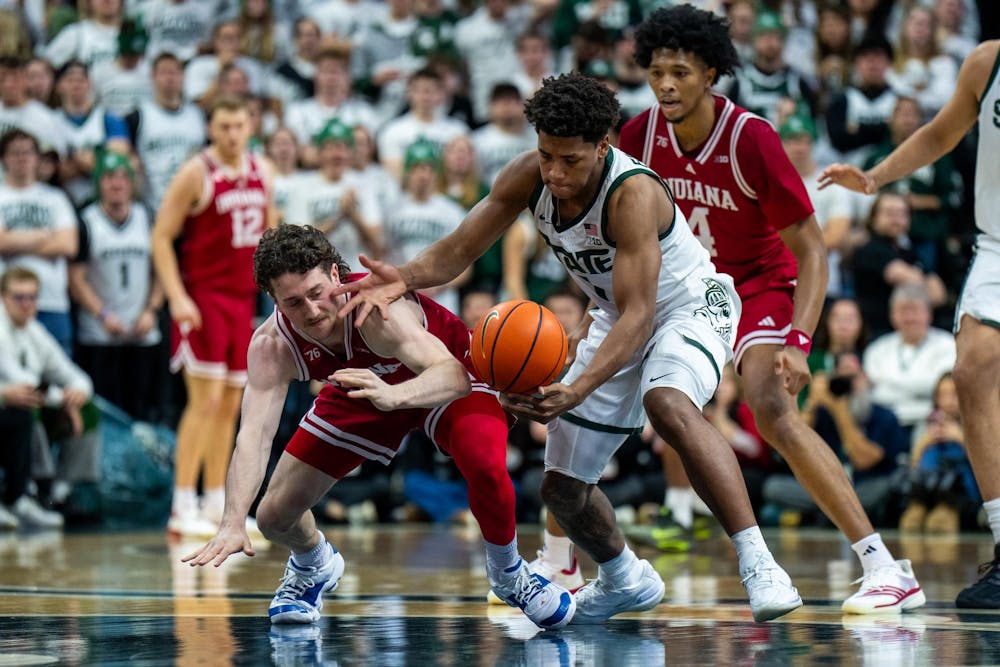 <p>Indiana Hoosiers guard Conor Enright (5) looses ball and Michigan State Spartans guard Jeremy Fears Jr. (1) receives during an NCAA Division I basketball game between Michigan State and Indiana at the Breslin Center in East Lansing, Michigan, on Tuesday, Jan. 13, 2026.</p>