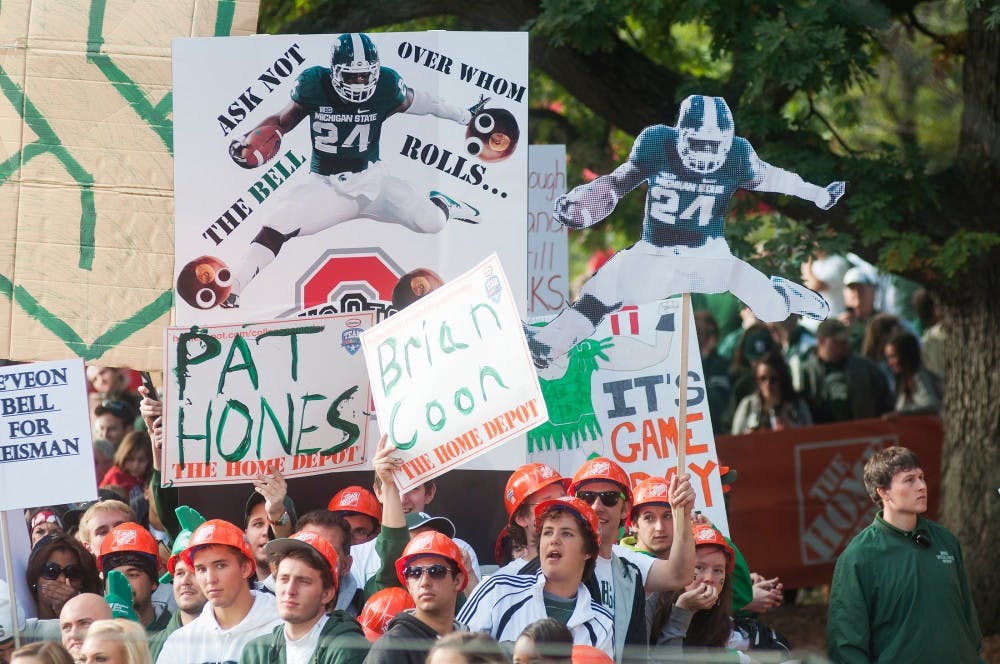 	<p>Fans hold carboard cutouts of junior running back Le&#8217;Veon Bell during a live <span class="caps">ESPN</span> College GameDay broadcast on Saturday, Sept. 29, 2012 near Beaumont Tower. GameDay is heading back to <span class="caps">MSU</span> on a spring football tour. Justin Wan/The State News</p>