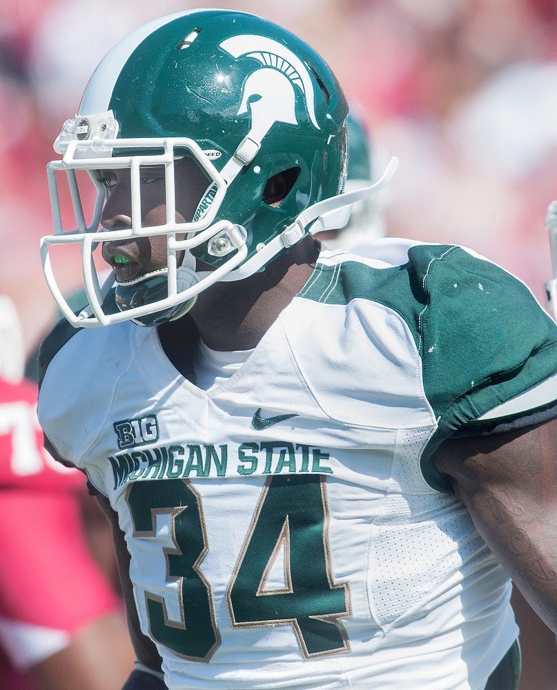 	<p>Sophomore linebacker Taiwan Jones walks off the field after a play Saturday, Oct. 6, 2012 at Memorial Stadium in Bloomington, Indiana. Despite defensive struggles in the first half, the Spartans were able to defeat Indiana University 31-27. Adam Toolin/The State News</p>