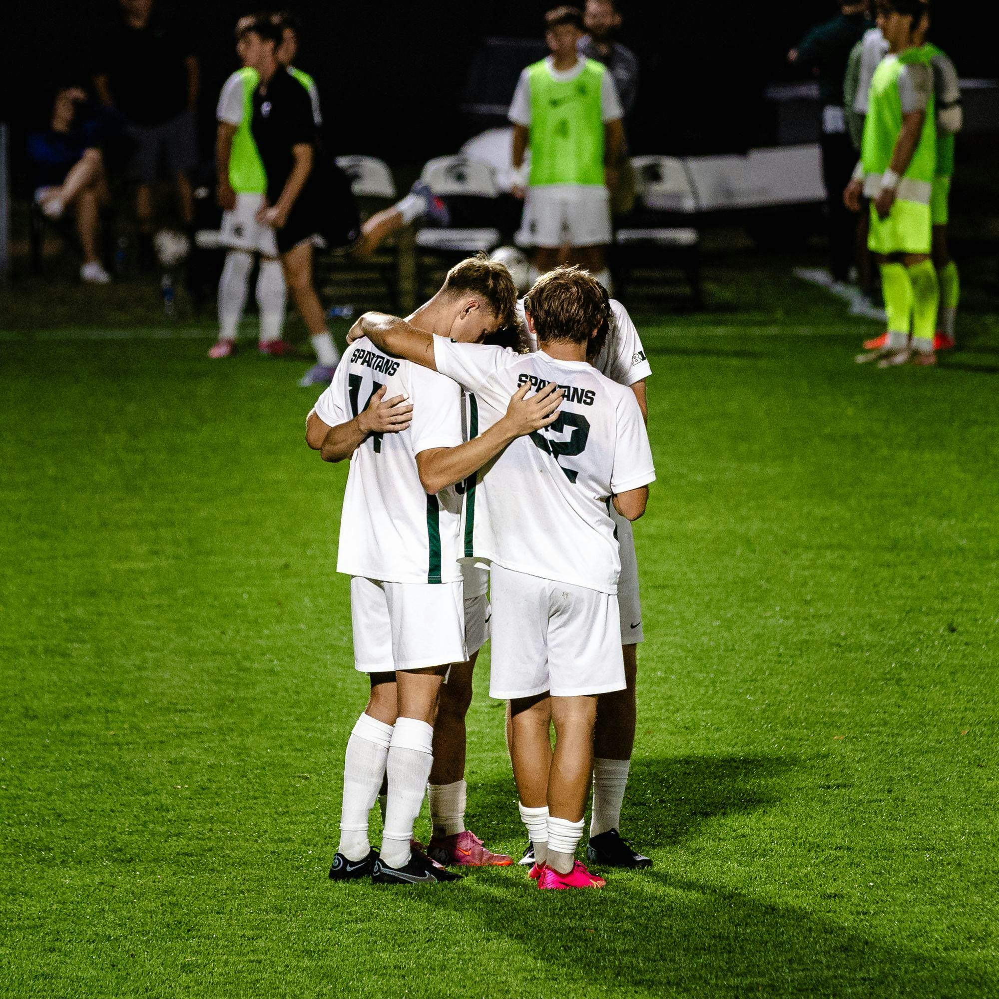 A group of Michigan State players gather to pray just before the start of the second half at DeMartin Stadium in East Lansing, Michigan on Sept. 19, 2025.
