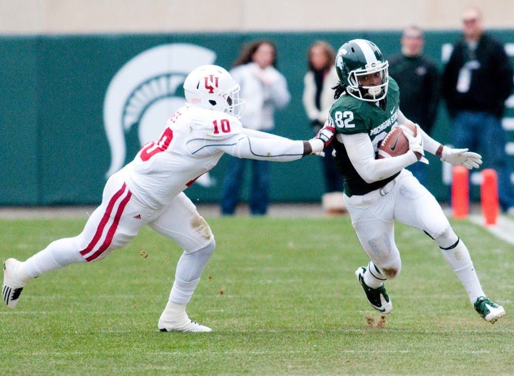 Senior wide receiver Keshawn Martin runs past Indiana safety Donnell Jones. The Spartans defeated the Hoosiers, 55-3, on Saturday afternoon at Spartan Stadium. Josh Radtke/The State News