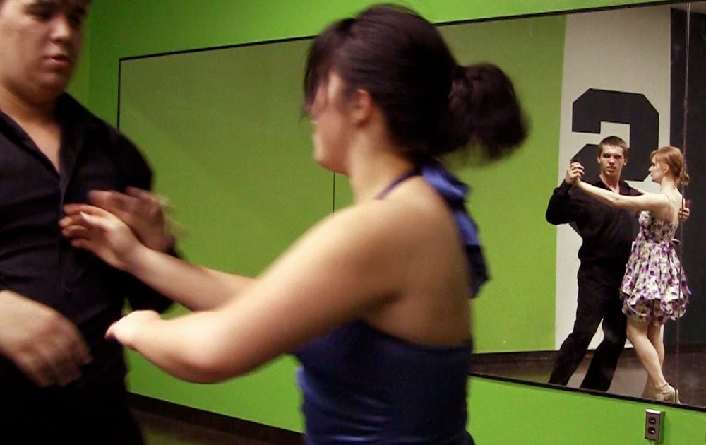 General management freshman Ethan Miller and kinesiology freshman Brittany Holmes, far right, dance together during practice on March 30 in Wonders Hall  in preparation for the Spartan Ballroom Dance Team's competition at University of Michigan. The team formed at the beginning of the spring semester as a more completitively-focused alternative to the MSU Ballroom Dance Team. Josh Sidorowicz/The State News