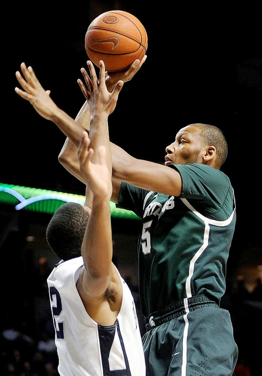 	<p>Michigan State Spartans&#8217; Adreian Payne shoots a basket over Penn State Nittany Lions&#8217; D.J. Newbill during the second half of a men&#8217;s college basketball game at the Bryce Jordan Center on Wednesday, January 16, 2013, in State College, Pennsylvania. The Spartans won, 81-72. Abby Drey/Centre Daily Times/MCT</p>