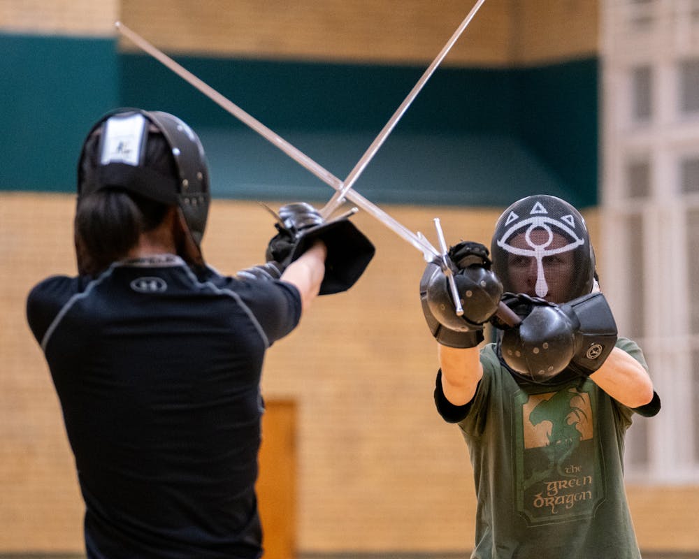 Students practicing different techniques and drills during a practice session for the MSU Renaissance Sword Society at IM Circle on March 28, 2024.