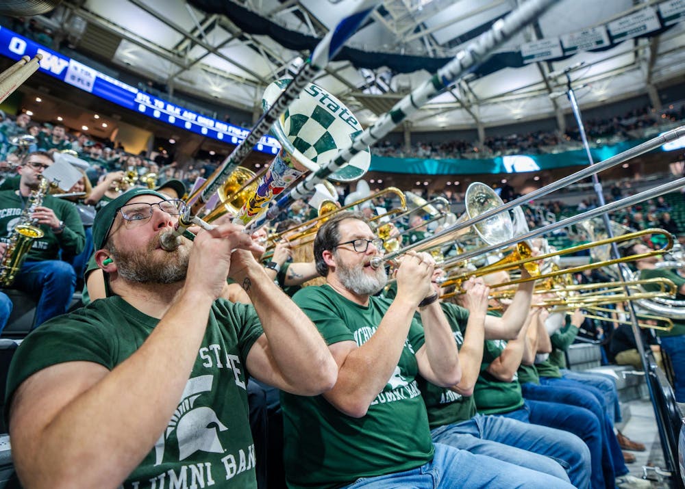 The Spartan Brass Alumni Band returns to perform at the annual Izzone alumni game during a game against the University of Washington at the Breslin Center in East Lansing, Michigan on January 9, 2025. Michigan State won 88-54. 