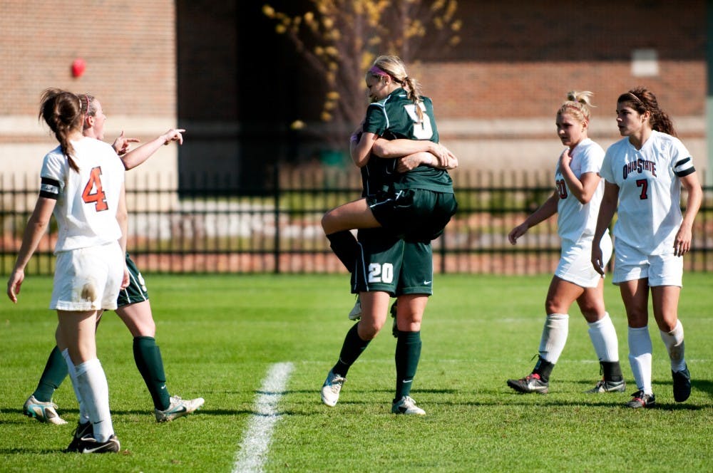 Senior forward Hannah Peterson and junior forward Olivia Stander celebrate after MSU broke the 0-0 stalemate with the Buckeyes late in the second half. The Spartans defeated Ohio State, 2-0, in their final home game on Sunday afternoon at DeMartin Stadium at Old College Field. 