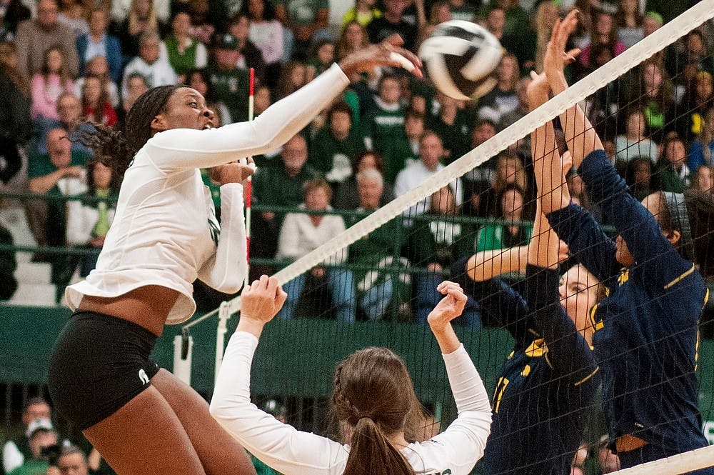 	<p>Senior middle blocker Alexis Mathews spikes the ball during the game against Michigan on Oct. 23, 2013, at Jenison Field House. The Spartans fell to the Wolverines, 3-1. Khoa Nguyen/The State News</p>